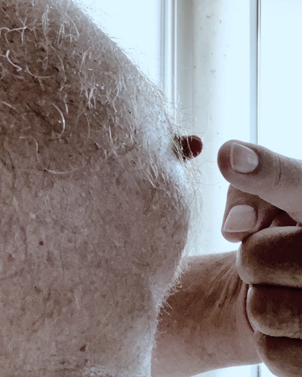 Malehypnosis fingertips teasing a sensitive nipple by the window